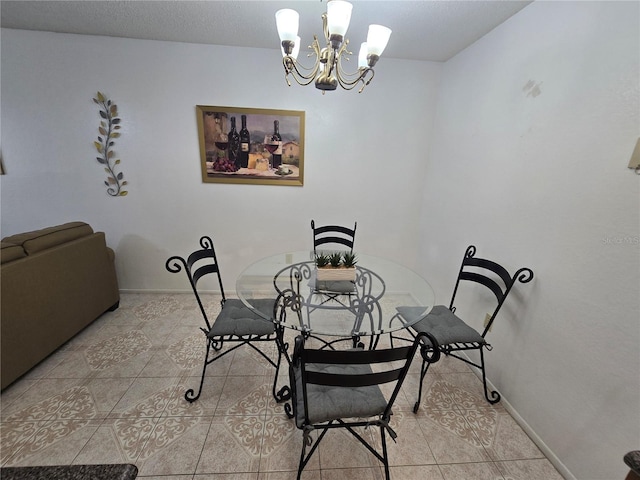 tiled dining space with an inviting chandelier