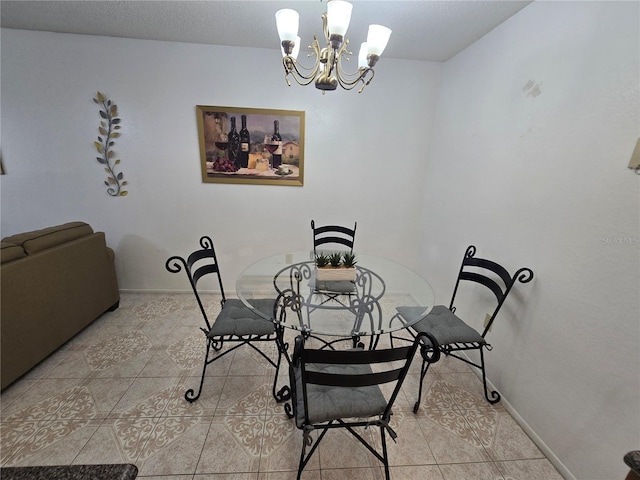 623 Dory Ln Unit 112, Altamonte Springs, FL 32714 - dining space with a chandelier, light tile patterned flooring, and baseboards