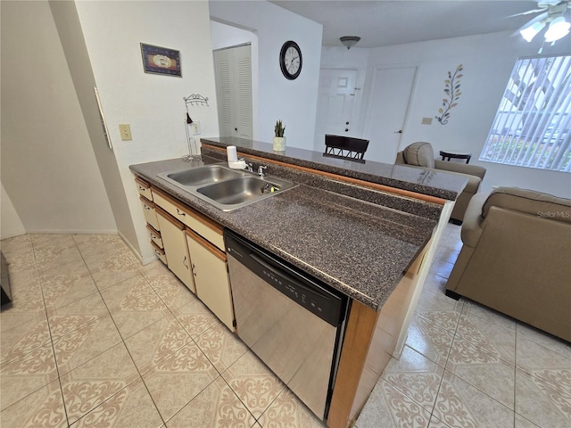 kitchen with stainless steel dishwasher, sink, ceiling fan, and light tile patterned floors