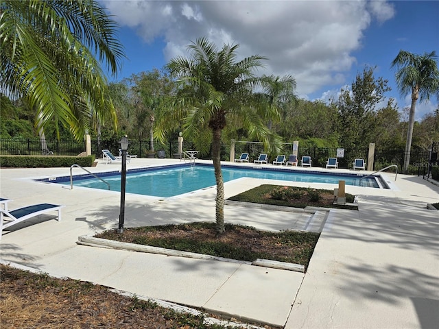 view of swimming pool featuring a patio area