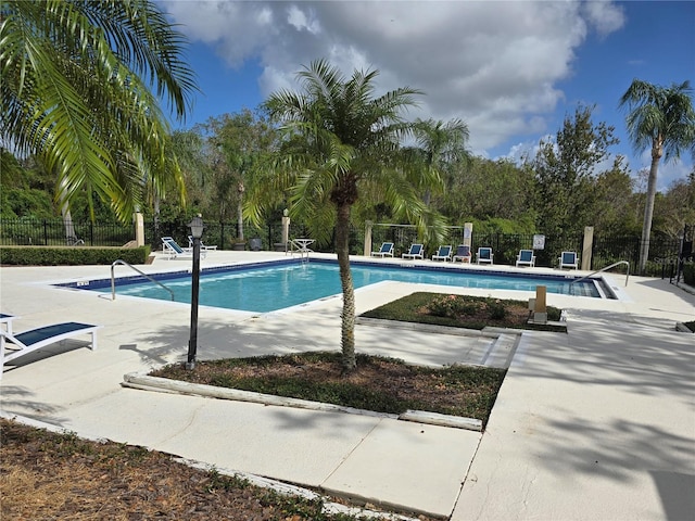 623 Dory Ln Unit 112, Altamonte Springs, FL 32714 - community pool featuring fence, a patio, and view of scattered trees