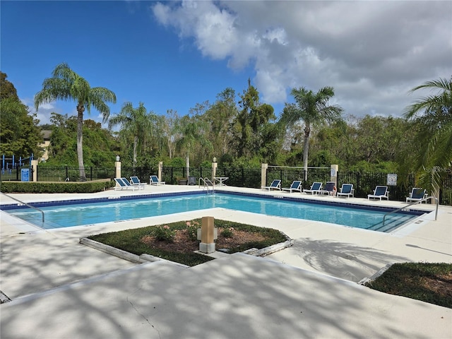 view of swimming pool with a patio