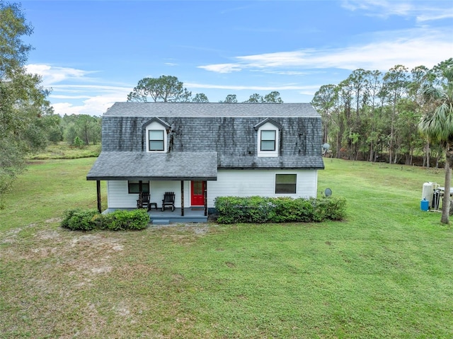 965 Keen Rd, Frostproof, FL 33843 - dutch colonial with a front yard, a porch, and roof with shingles