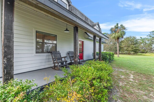 965 Keen Rd, Frostproof, FL 33843 - doorway to property with a porch and a yard
