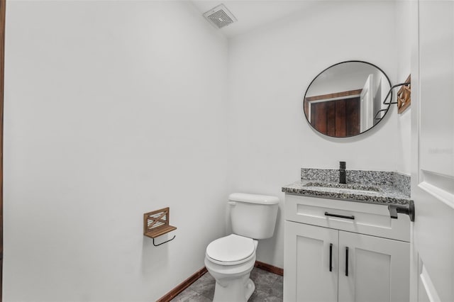 bathroom with tile patterned floors, vanity, and toilet