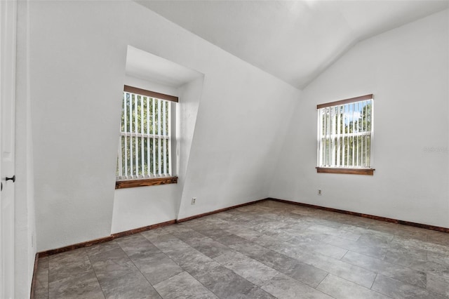 965 Keen Rd, Frostproof, FL 33843 - spare room with lofted ceiling and baseboards