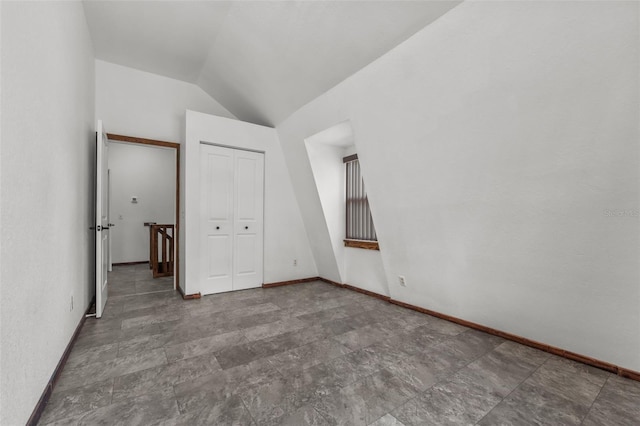 interior space featuring a closet and lofted ceiling