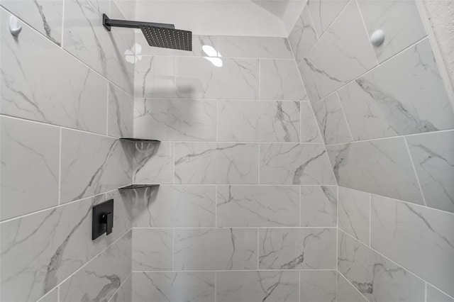 bathroom with tiled shower