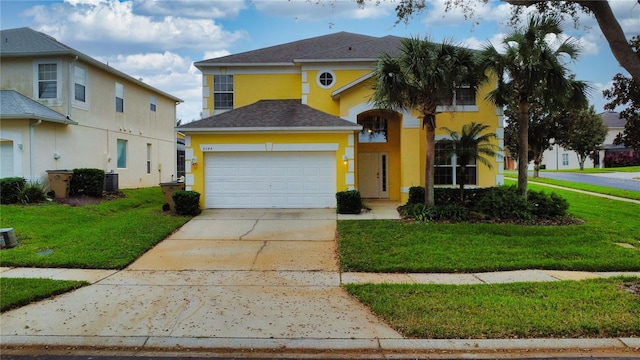 view of front of property with a garage, central AC unit, and a front yard