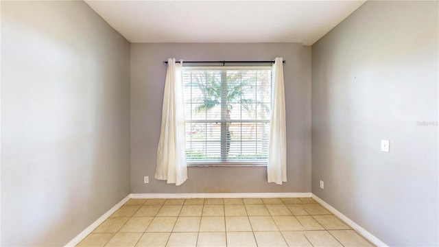 spare room with light tile patterned flooring