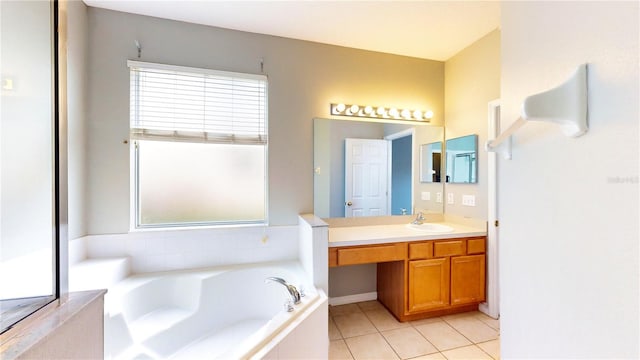 bathroom with vanity, tiled bath, and tile patterned floors