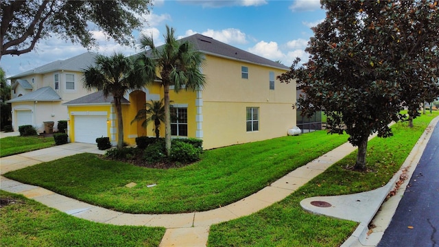 view of side of home featuring a lawn and a garage