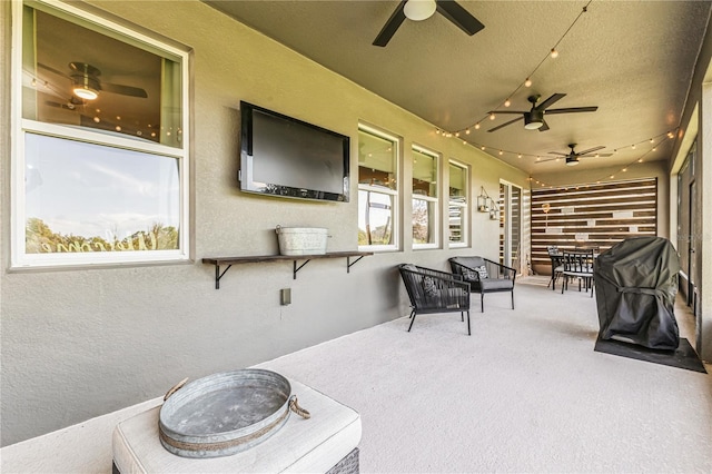 view of patio / terrace featuring ceiling fan