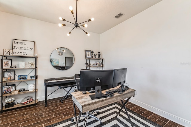 home office with an inviting chandelier, dark hardwood / wood-style floors, and vaulted ceiling