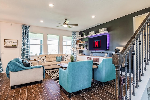 living room featuring dark hardwood / wood-style floors and ceiling fan