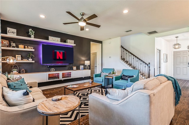 living room with ceiling fan and wood-type flooring