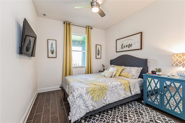 bedroom with ceiling fan and dark hardwood / wood-style flooring