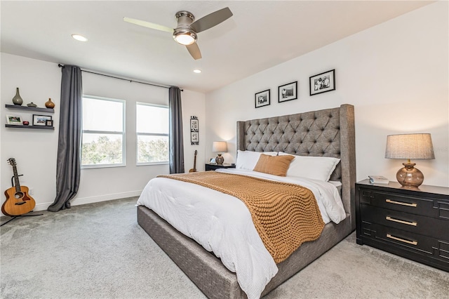 bedroom with ceiling fan and light colored carpet