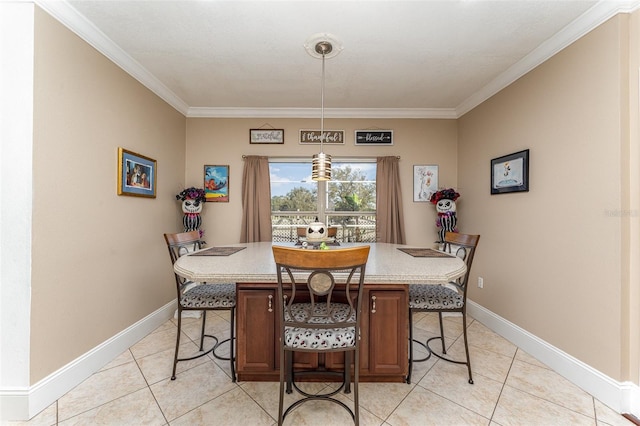 dining area with ornamental molding and light tile patterned floors