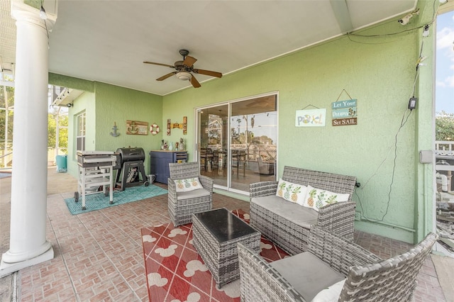 view of patio / terrace featuring ceiling fan and an outdoor living space