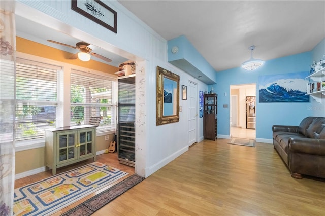 living room featuring ceiling fan and light wood-type flooring