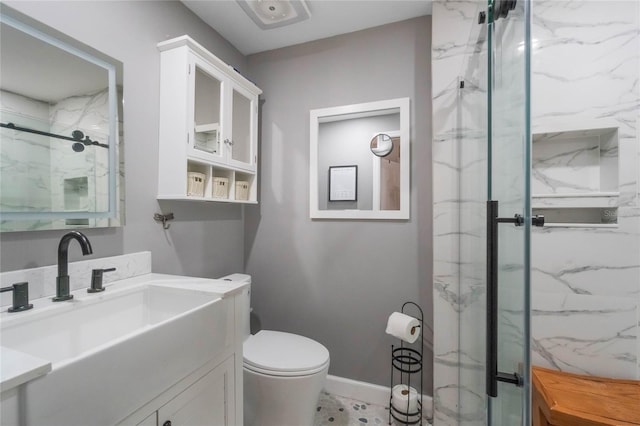 bathroom with vanity, toilet, and an enclosed shower