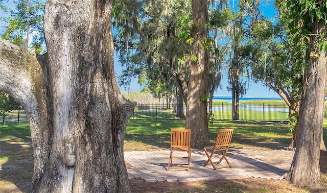 view of yard with a patio area and a water view