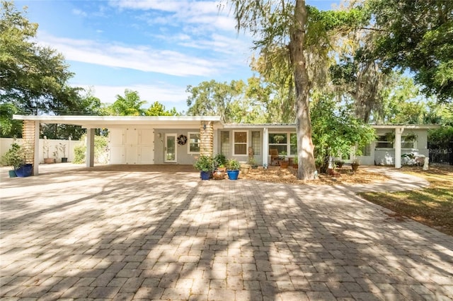 view of front facade with a carport