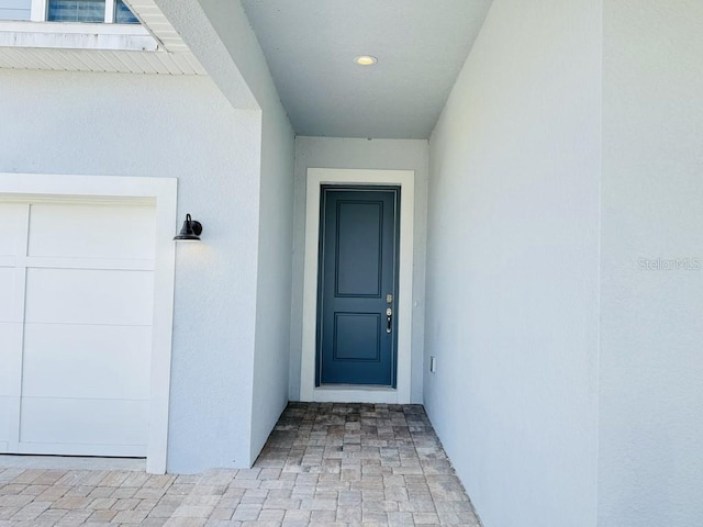 entrance to property featuring a garage