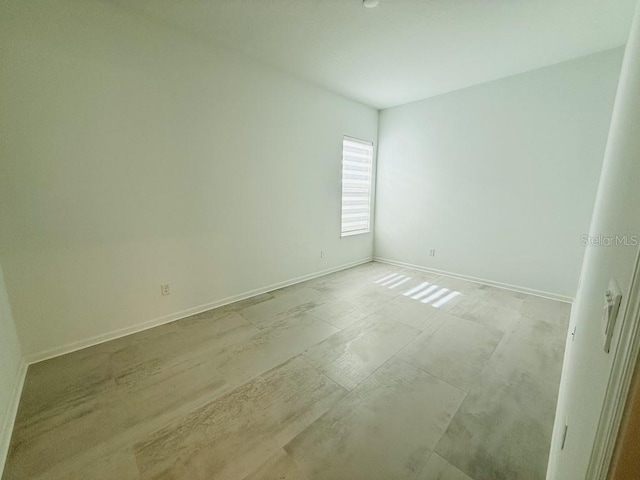 empty room with baseboards