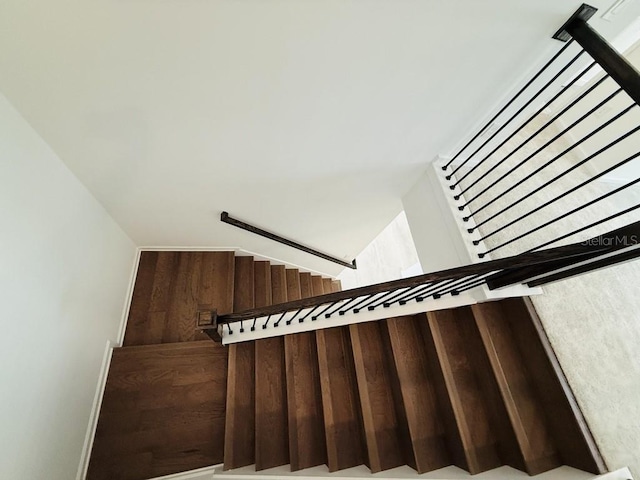 staircase with lofted ceiling