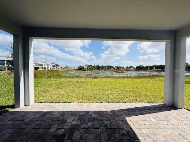 view of patio with a water view