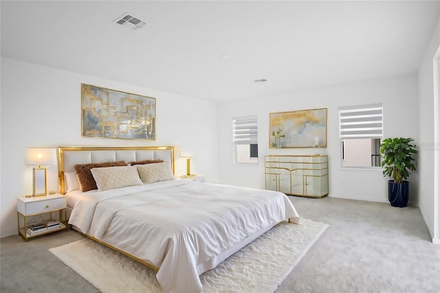 carpeted bedroom with visible vents