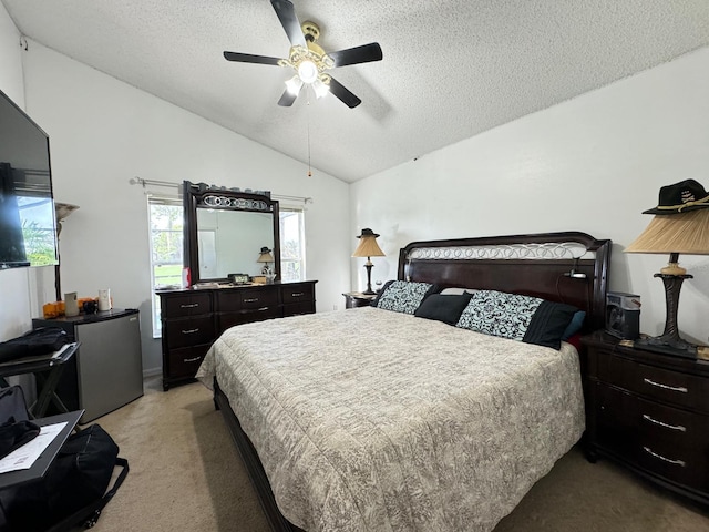 carpeted bedroom with ceiling fan, a textured ceiling, and lofted ceiling