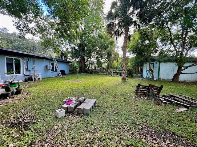 view of yard with a wall mounted AC