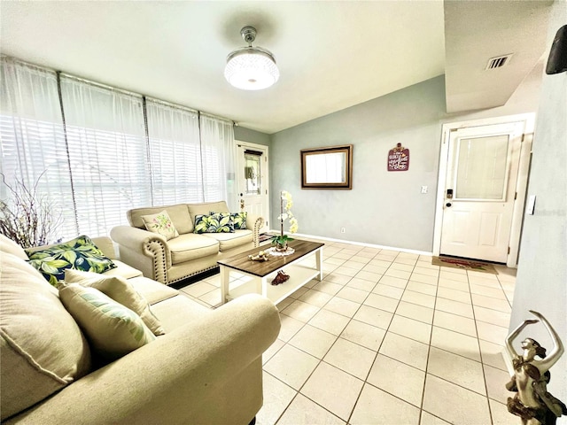 tiled living room with vaulted ceiling