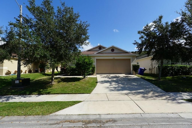 view of front of property featuring a front yard and a garage