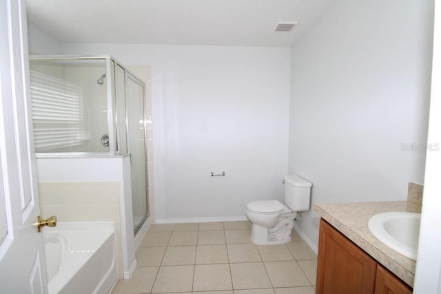 full bathroom featuring tile patterned floors, vanity, toilet, and shower with separate bathtub