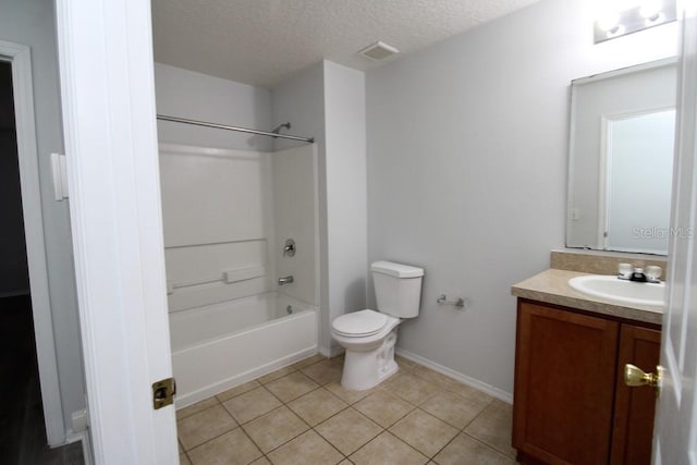 full bathroom featuring vanity, shower / washtub combination, tile patterned flooring, toilet, and a textured ceiling