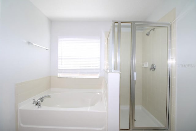 bathroom with independent shower and bath