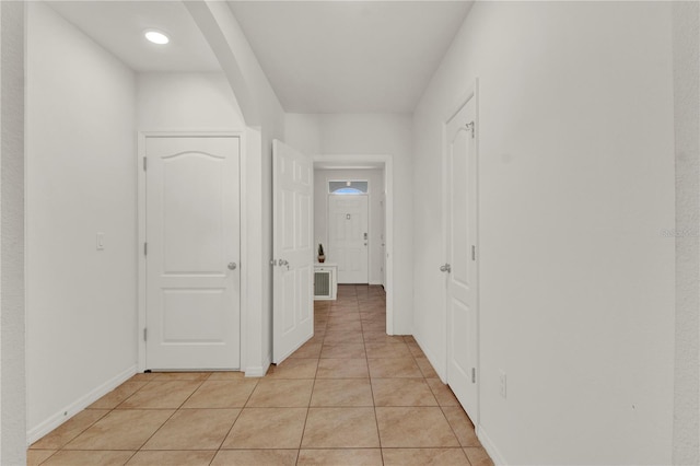 hall with light tile patterned flooring