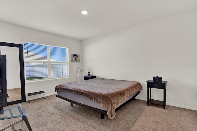 bedroom featuring light carpet