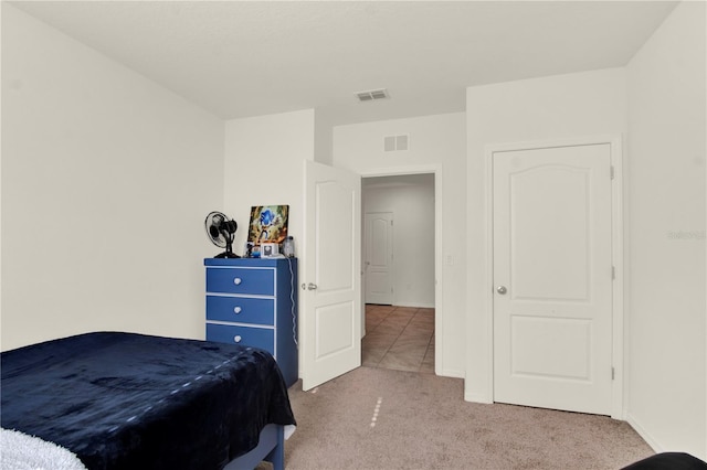 bedroom with light carpet