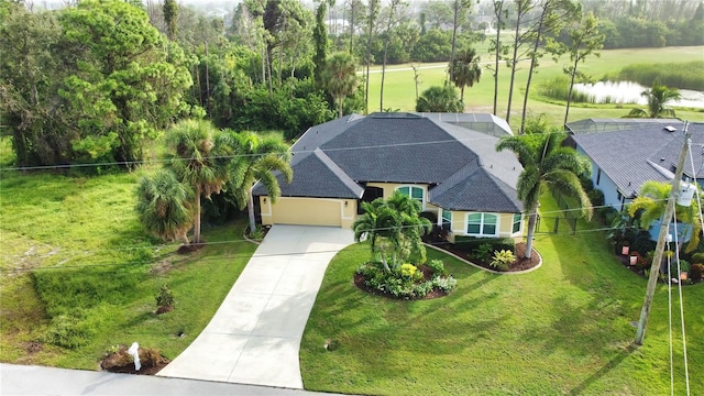 birds eye view of property with a water view