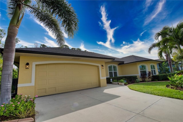 39 Tee View Pl, Rotonda West, FL 33947 - ranch-style house with stucco siding, driveway, a garage, and a front lawn
