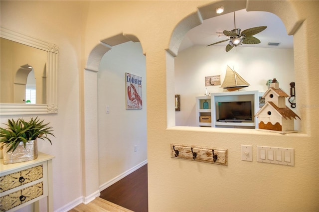 hallway with hardwood / wood-style floors