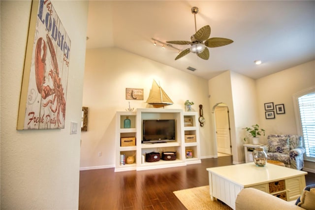 living room with vaulted ceiling, dark hardwood / wood-style floors, and ceiling fan