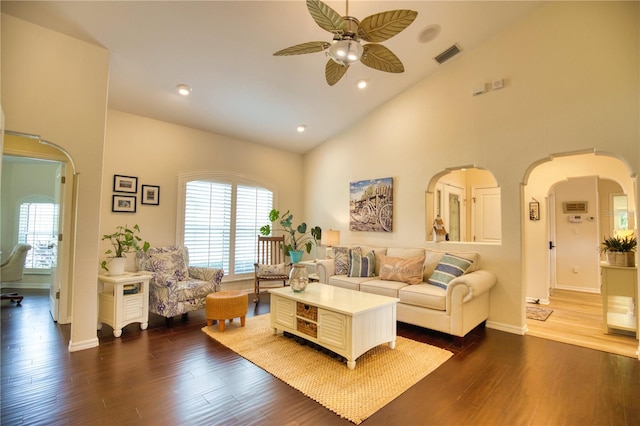 living room featuring high vaulted ceiling, dark wood-type flooring, and ceiling fan