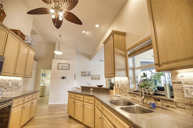 39 Tee View Pl, Rotonda West, FL 33947 - kitchen featuring a sink, stainless steel electric range, light brown cabinets, high vaulted ceiling, and decorative backsplash