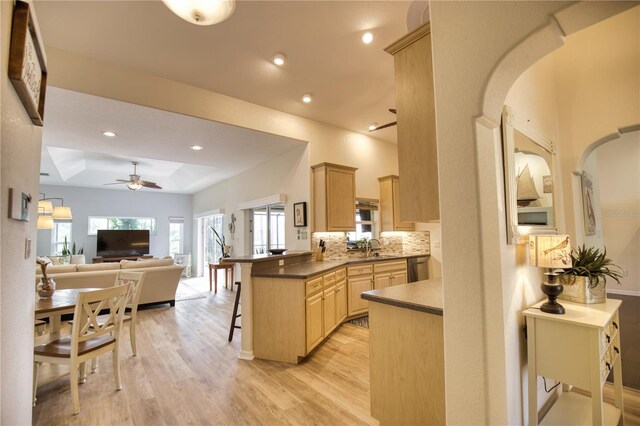 39 Tee View Pl, Rotonda West, FL 33947 - kitchen featuring light brown cabinets, a kitchen bar, a ceiling fan, a sink, and open floor plan